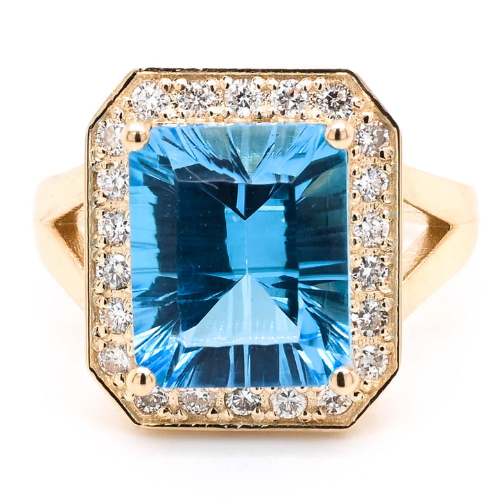 14KT Yellow Gold 5.50CT Blue Topaz & Diamond Halo Set Ring.