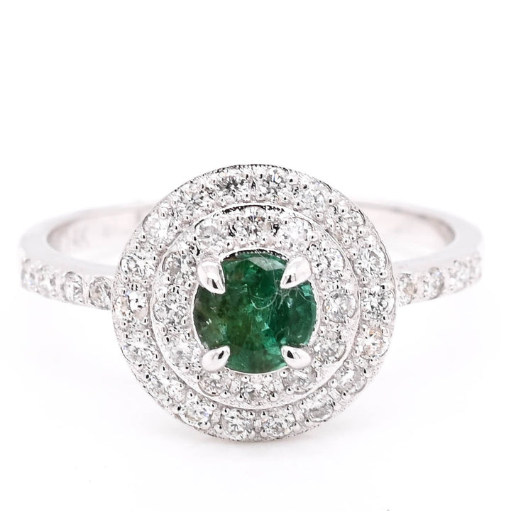 14KT White Gold Emerald & Diamond double Halo Set Ring.

Diamonds: 0