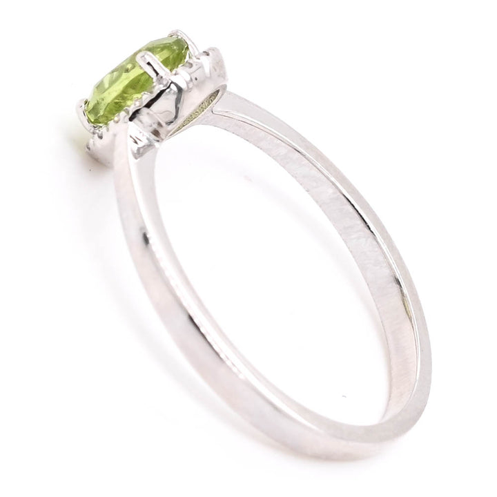 14KT White Gold 0.69CT Oval Shape Peridot & Diamond Halo Set Ring.