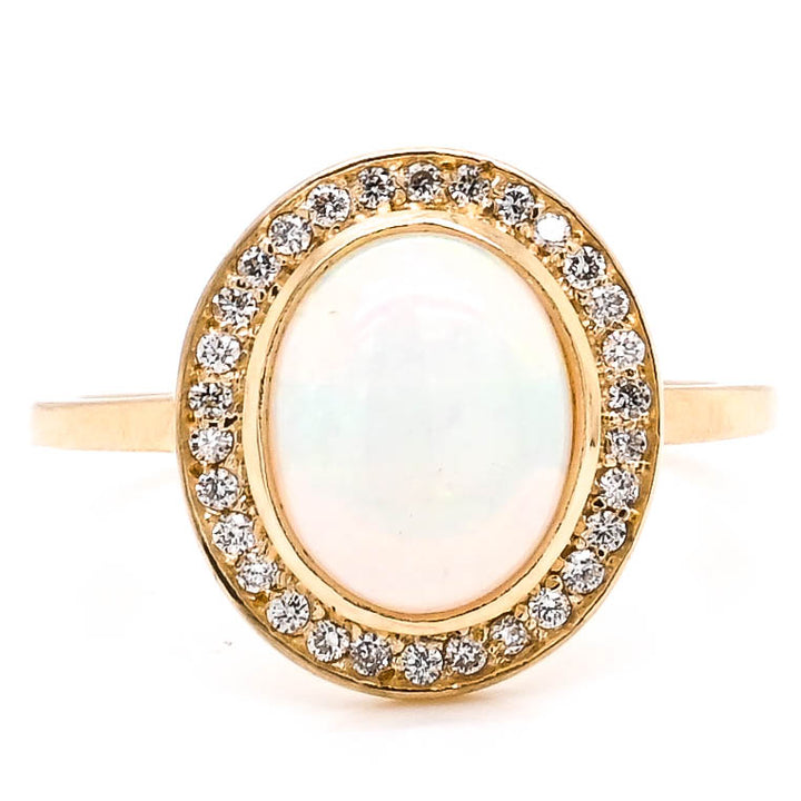 14KT Yellow Gold Cabachon Opal & Diamond Halo Set Ring.