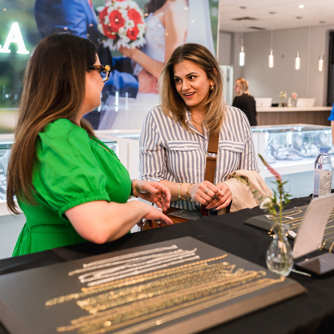 A picture of two women taking about jewellery