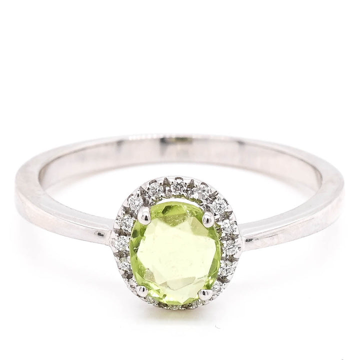 14KT White Gold 0.69CT Oval Shape Peridot & Diamond Halo Set Ring.