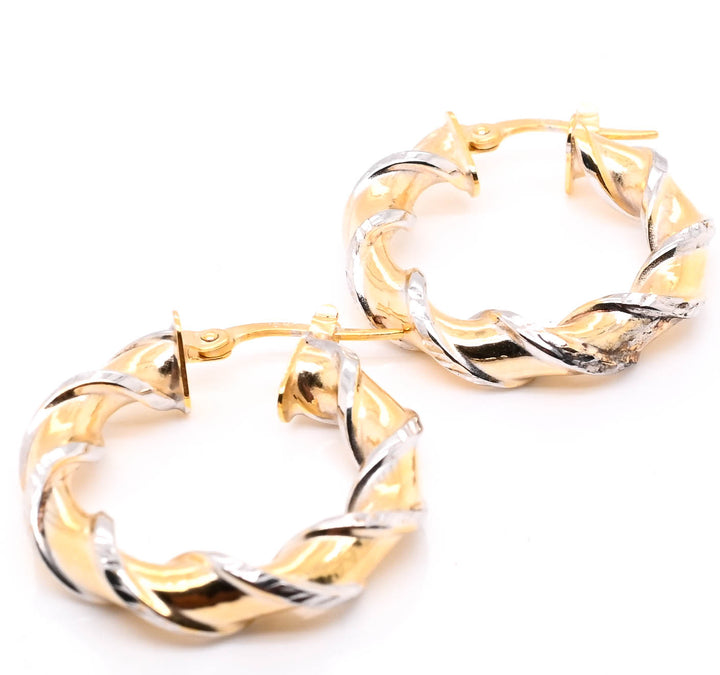 10KT Two-Tone Gold Twisted Hoop Earrings.