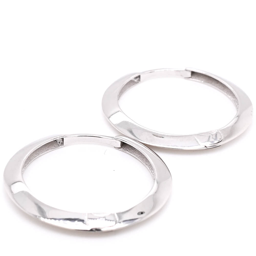 10KT White Gold Huggie Earrings.