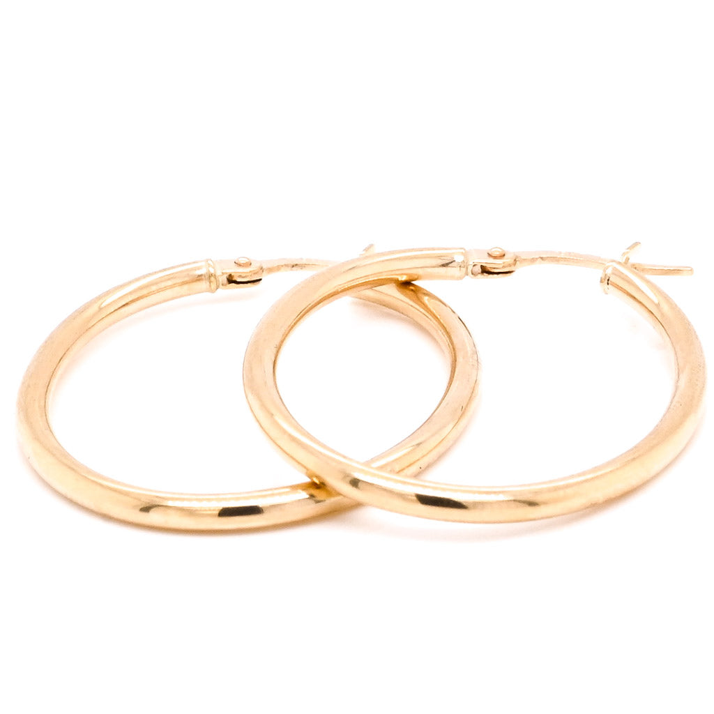 10 Karat Yellow Gold Oval Oval Hoop Earrings.