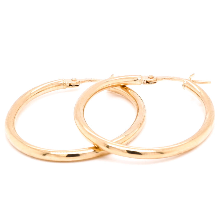 10 Karat Yellow Gold Oval Oval Hoop Earrings.